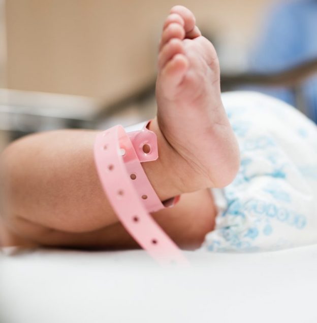 newborn baby's foot in hospital